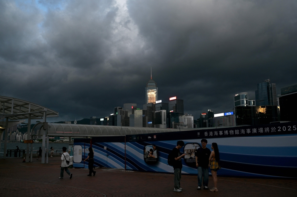 Storm clouds gather over buildings in Hong Kong on September 5, 2024, as super typhoon Yagi tracked across the South China Sea towards the southern China coast. — AFP pic
