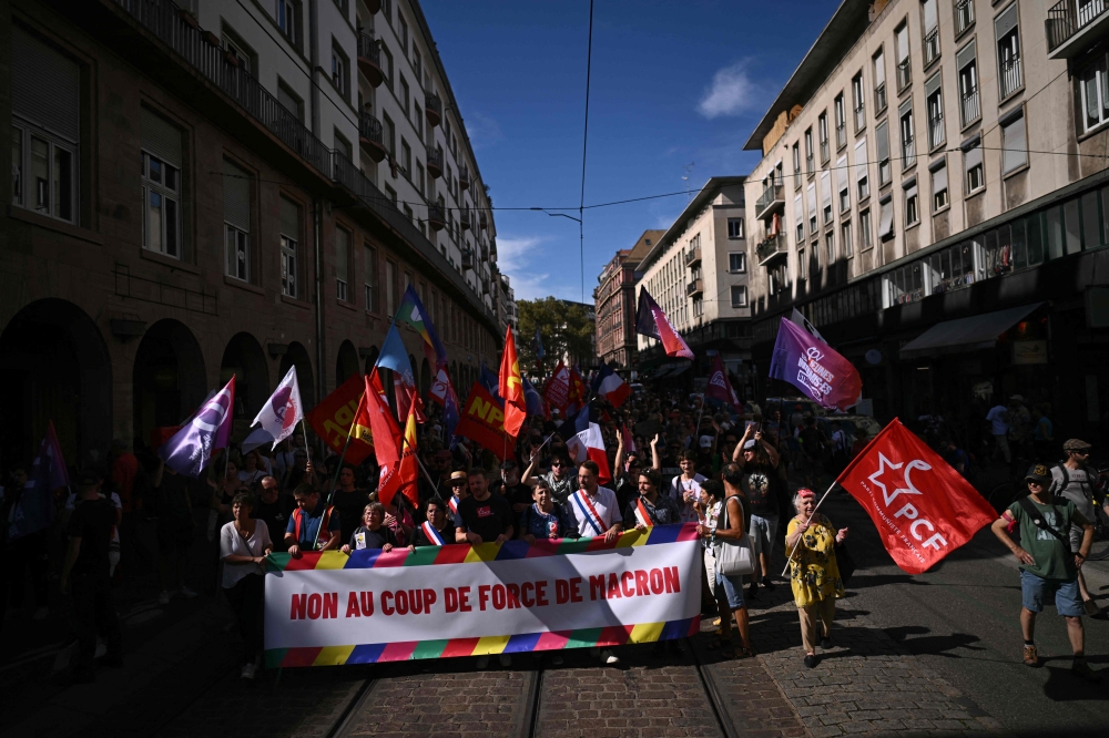 Demonstrators march against the appointment of right-wing Prime Minister Michel Barnier by France’s President Emmanuel Macron in Strasbourg, eastern France on September 7, 2024. — AFP pic