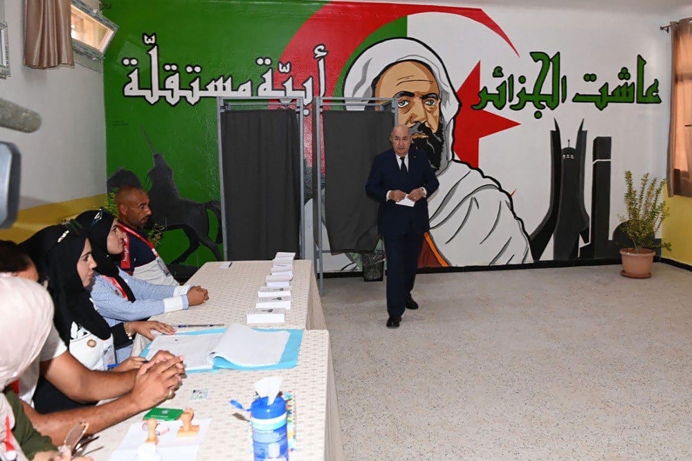 A handout picture released by the Algerian Presidency Facebook page, shows Algeria's incumbent President Abdelmadjid Tebboune arriving to vote in Algiers on September 7, 2024. — AFP pic