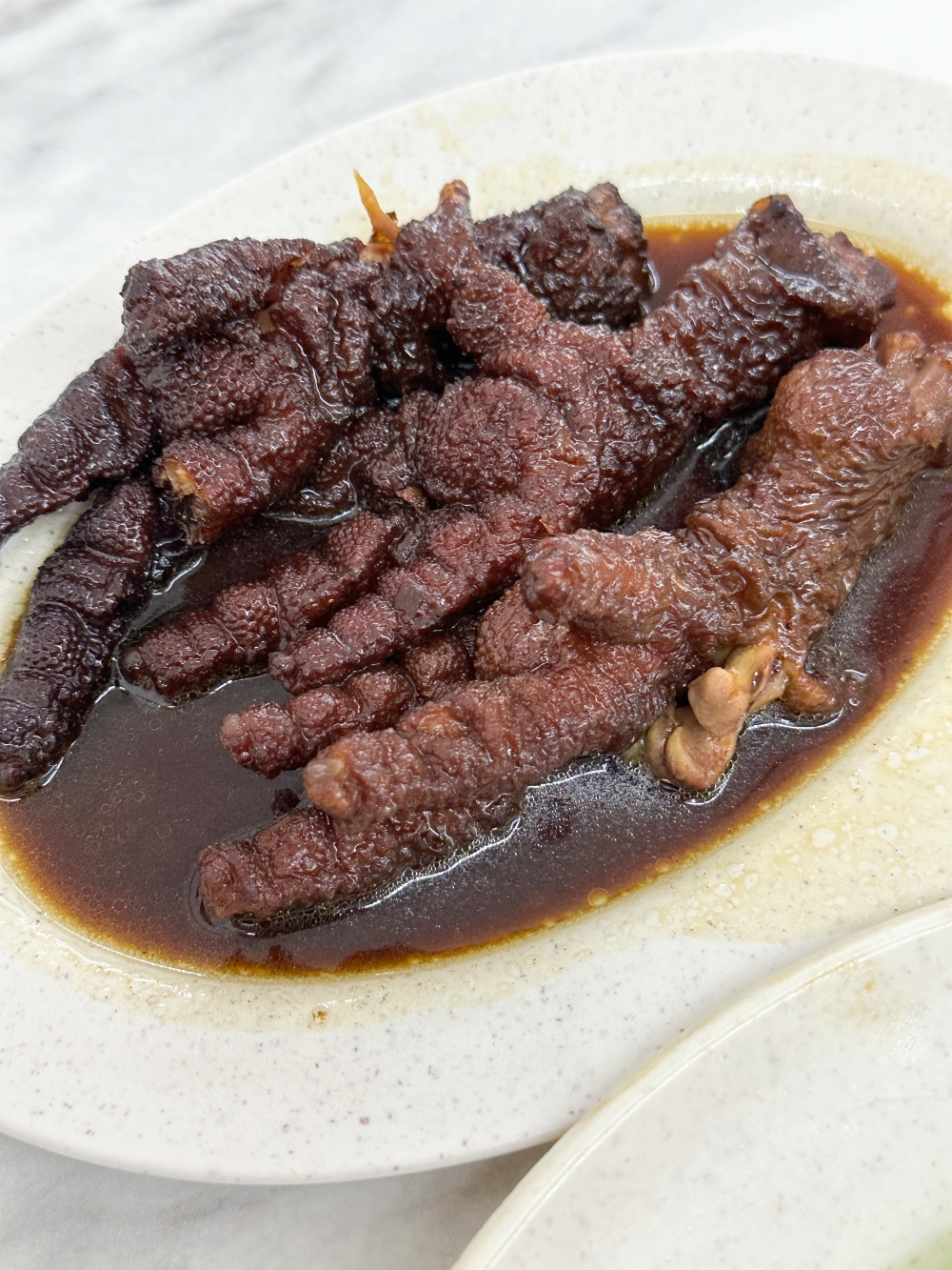 Braised chicken feet with shiitake mushrooms is also a great topping for your noodles — Picture by Lee Khang Yi