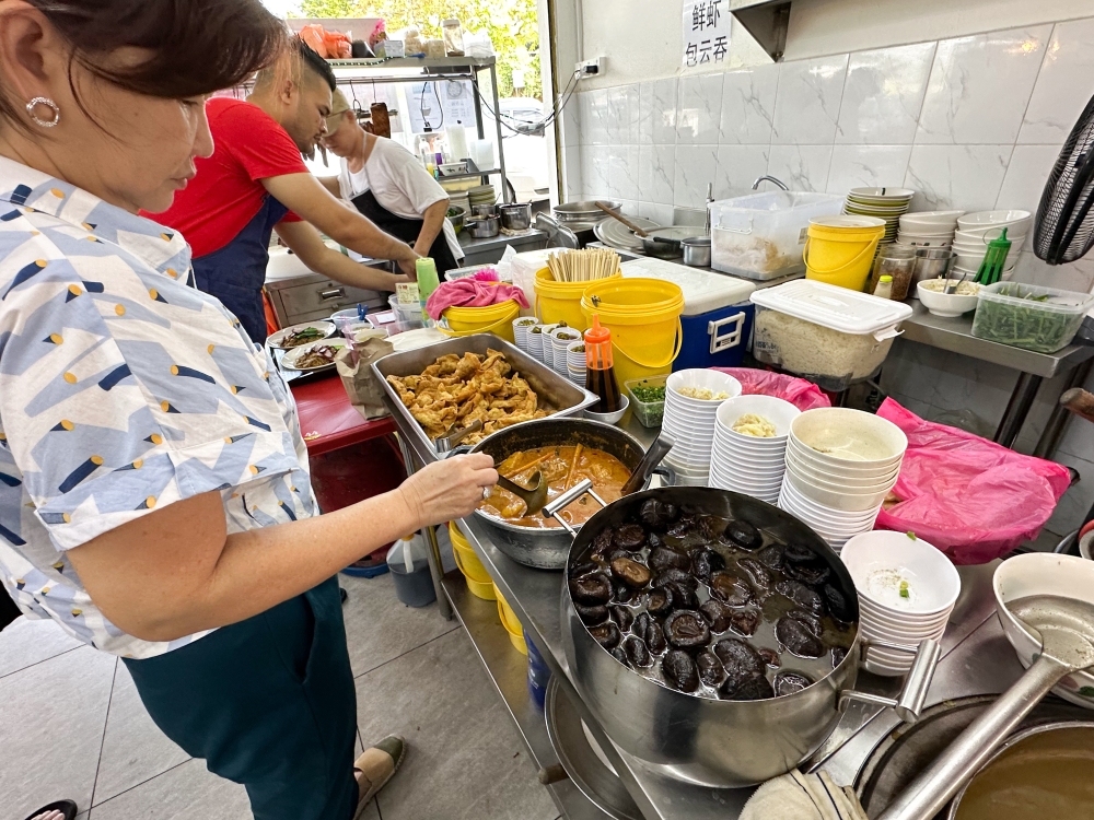 Select your toppings for your ‘wantan mee’ from the counter — Picture by Lee Khang Yi