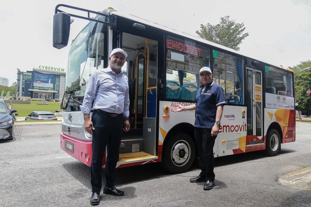 Digital Minister Gobind Singh Deo and Transport Minister Anthony Loke participate in a test drive during the Autonomous Electric Bus showcase at Futurise Centre in Cyberjaya September 9, 2024. — Picture by Sayuti Zainudin