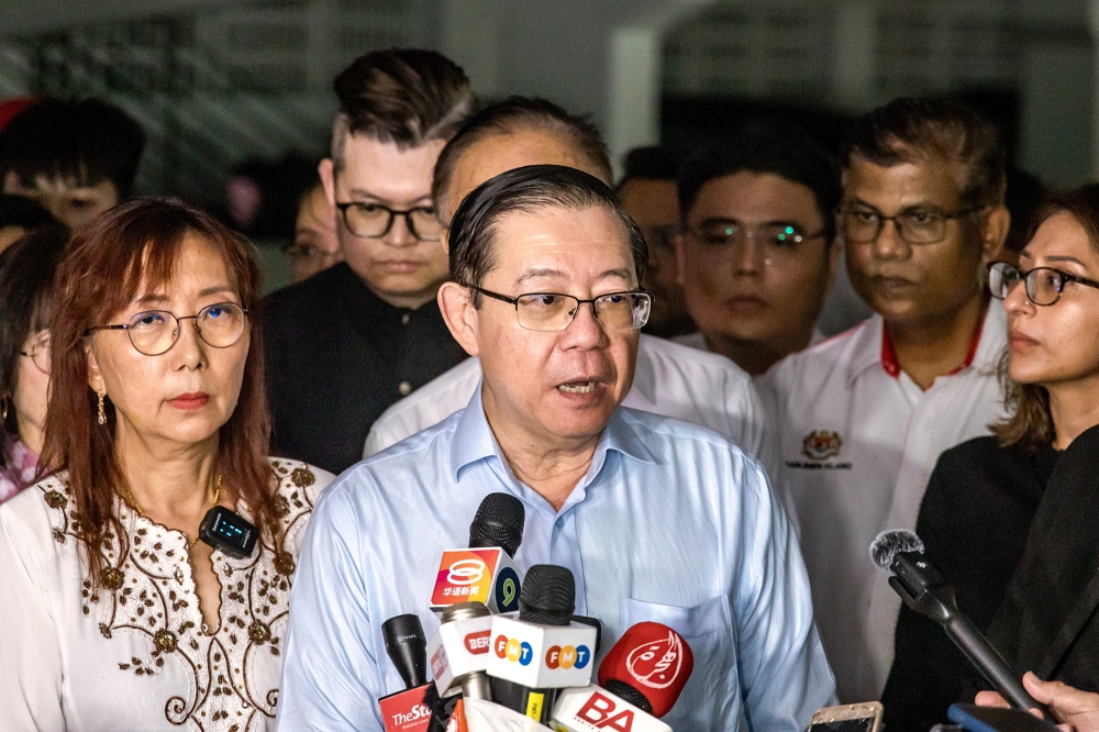 DAP chairman Lim Guan Eng speaks to reporters after Seputeh MP Teresa Kok gave her statement to the police at Bukit Aman police headquarters in Kuala Lumpur September 10, 2024. — Picture by Firdaus Latif