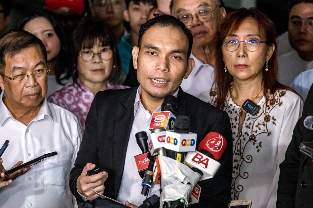 Lawyer Syahredzan Johan addresses the media after Seputeh MP Teresa Kok gave her statement to the police at Bukit Aman police headquarters in Kuala Lumpur September 10, 2024. — Picture by Firdaus Latif