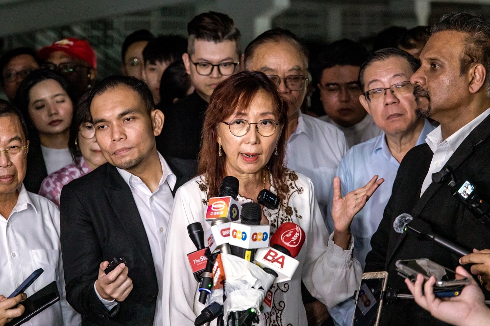 Seputeh MP Teresa Kok speaks to reporters after giving her statement to the police at Bukit Aman police headquarters in Kuala Lumpur September 10, 2024. — Picture by Firdaus Latif