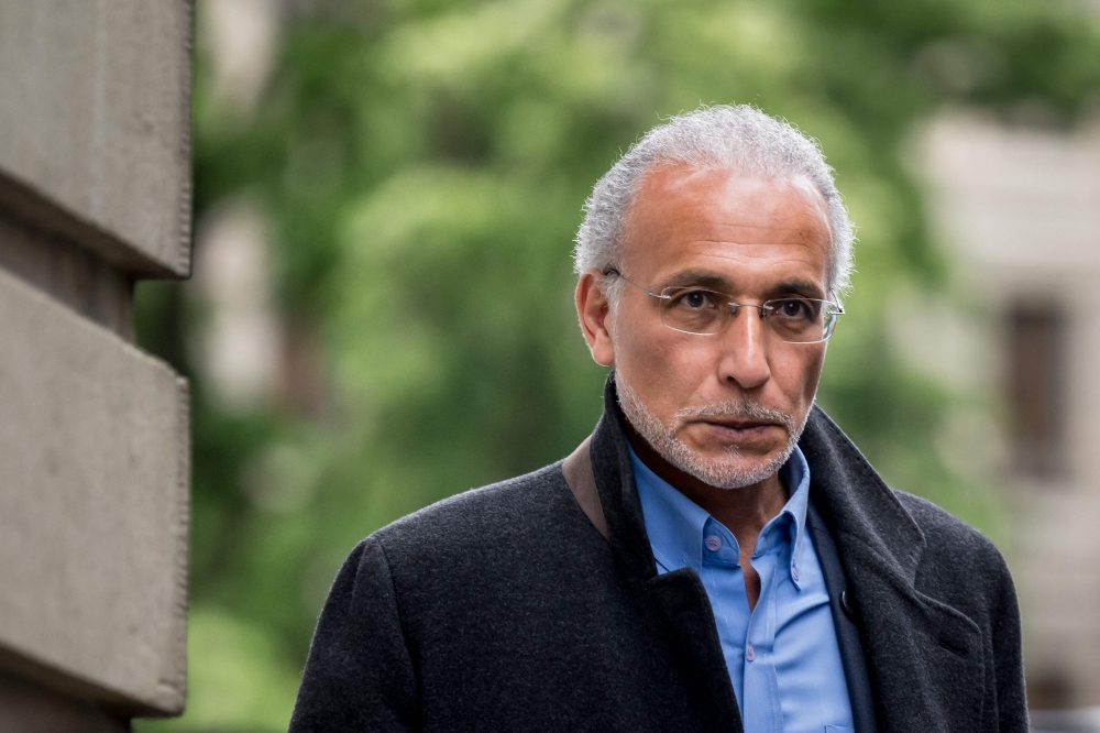 Swiss leading Islamic scholar Tariq Ramadan arrives at Geneva's courthouse on May 27, 2024, prior to his appeal trial over charges of rape and sexual coercion. — AFP pic
