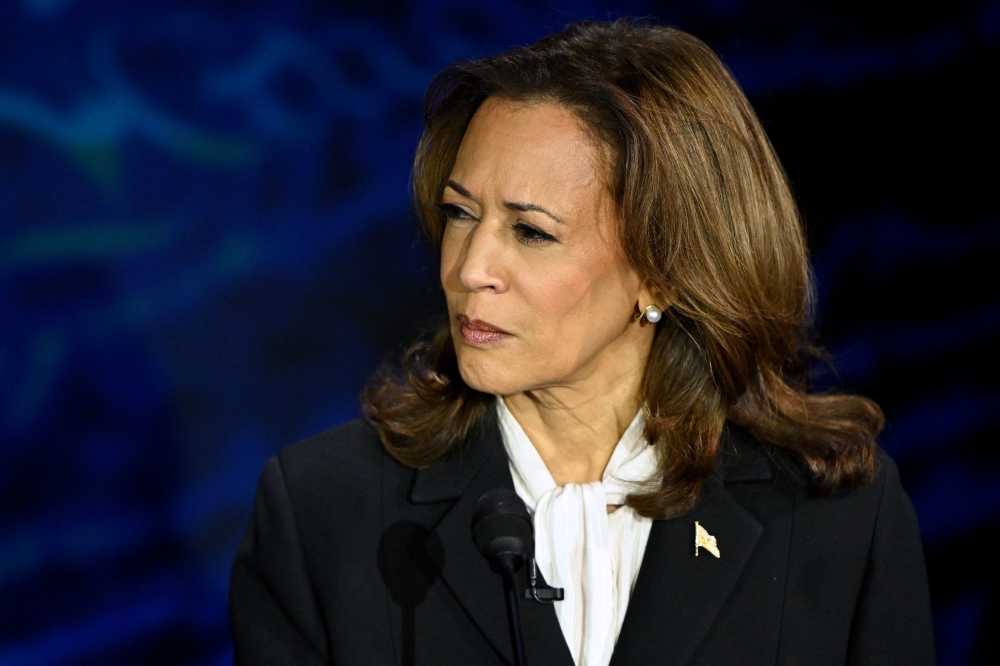 US Vice President and Democratic presidential candidate Kamala Harris gestures as former US President and Republican presidential candidate Donald Trump speaks during a presidential debate at the National Constitution Center in Philadelphia, Pennsylvania, on September 10, 2024. — AFP pic