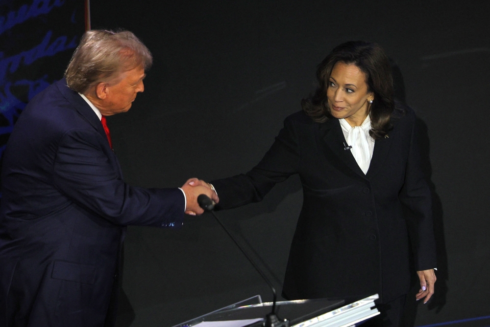 Kamala Harris forced Donald Trump to shake hands, something he and her predecessor as the Democratic presidential nominee, Joe Biden, did not do in June. — Reuters pic