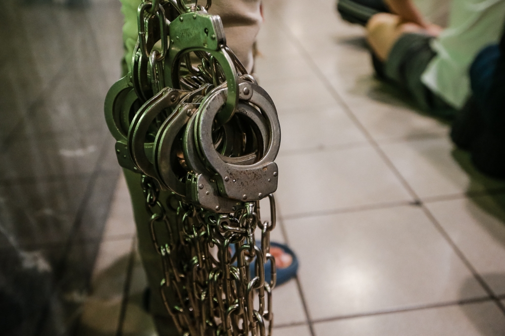 An illustrative photo shows shackles held together with more shackles. —Picture By Raymond  Manuel