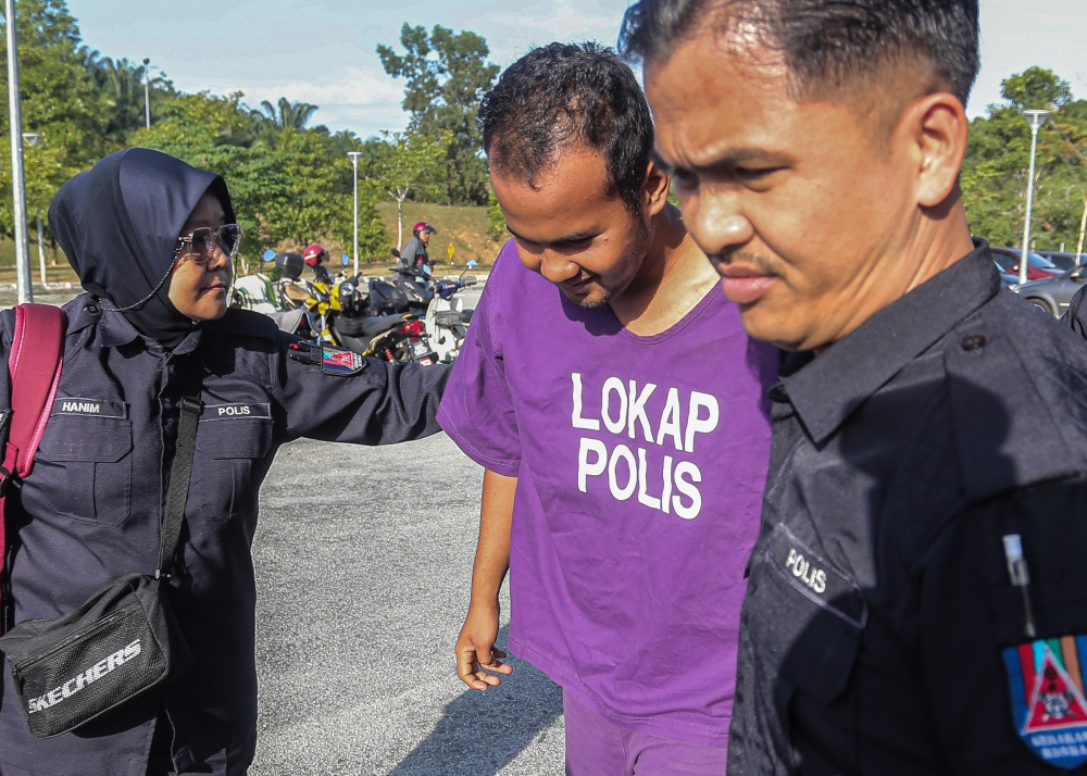 A cleaner was sentenced to seven days in jail and fined RM800 by the Magistrate's Court in Tapah after being found guilty of uploading defamatory comments on social media against policemen who were killed in a shooting incident at the Ulu Tiram Police Station. Johor last May September 11, 2024. — Bernama pic