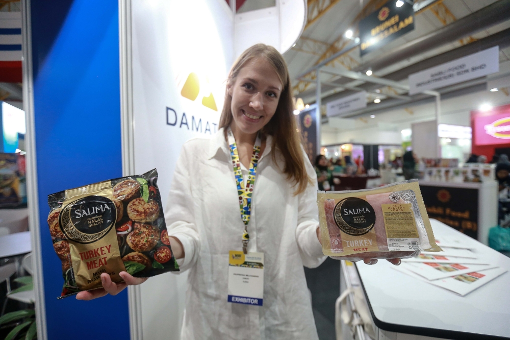 A Russian salesperson introduced Damate’s halal-certified turkey brand, which targets the Muslim market. — Picture by Sayuti Zainudin