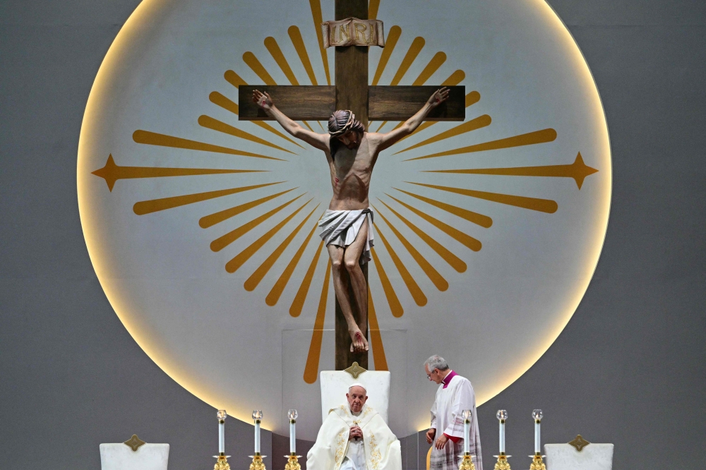 Pope Francis leads a holy mass at the National Stadium in Singapore on September 12, 2024. — AFP pic