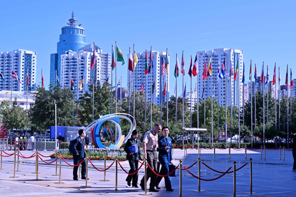 Delegates arrive at the venue of the 11th Xiangshan Forum at the Beijing International Convention Center on September 12, 2024. — AFP pic