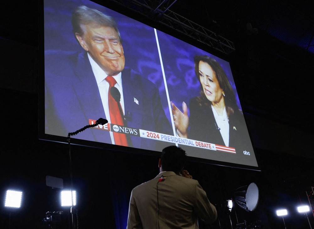 A screen displays the presidential debate hosted by ABC between Republican presidential nominee, former Us President Donald Trump and Democratic presidential nominee, US Vice President Kamala Harris in Philadelphia, Pennsylvania, September 10, 2024. — Reuters pic 