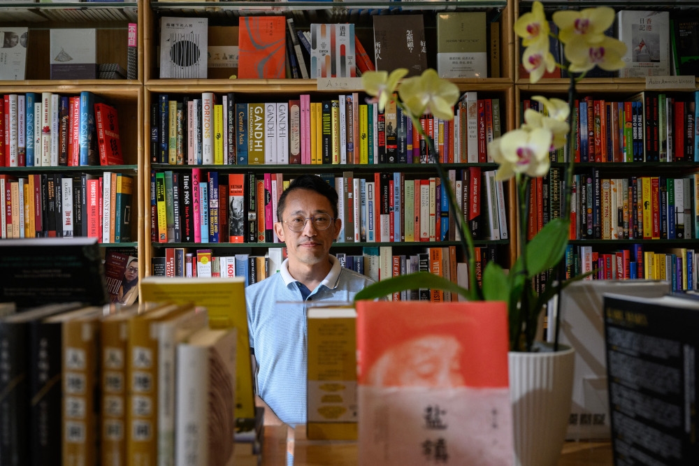 Yu Miao, owner of JF Books, poses for a portrait at his bookstore in Washington, DC, on September 6, 2024. — AFP pic 