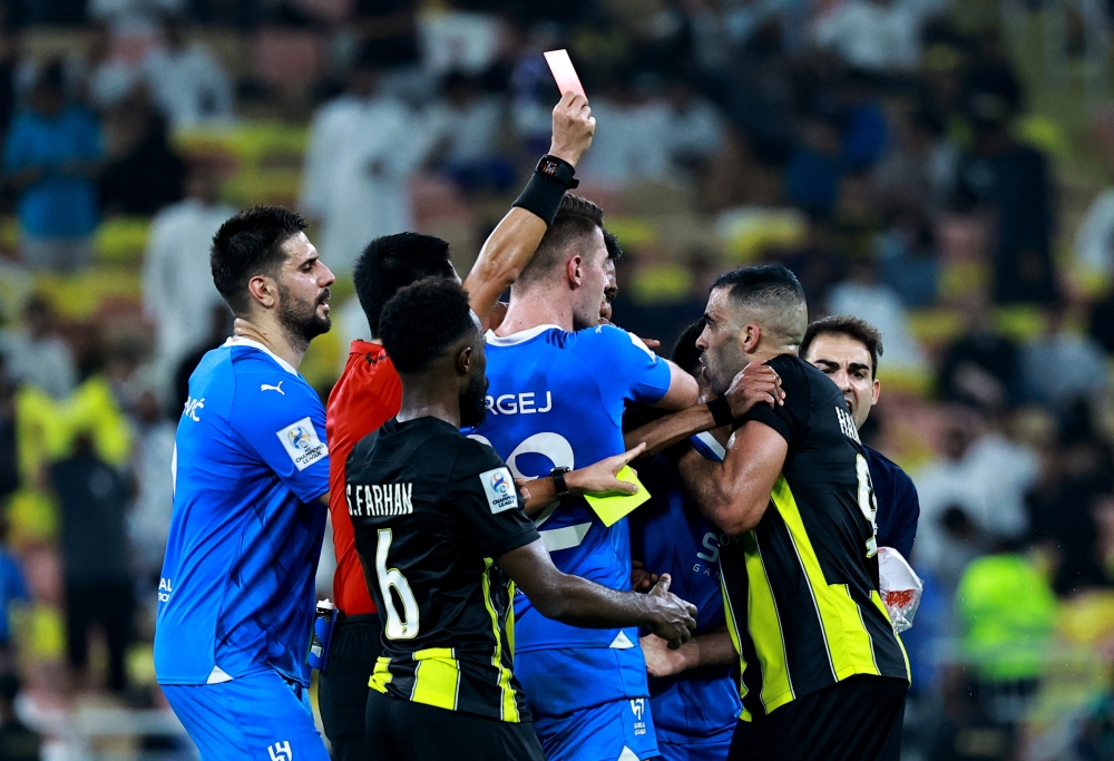 File picture of Al Ittihad’s Abderrazak Hamdallah reacting after being shown a red card during the Asian Champions League quarter-final match between Al Ittihad and Al Hilal at the King Abdullah Sports City, Jeddah, March 12, 2024. — Reuters pic 
