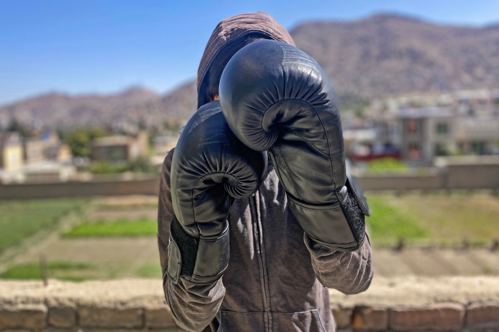 In this photograph taken on July 7, 2024, an Afghan female boxer poses during a training session in Kabul. — AFP pic 