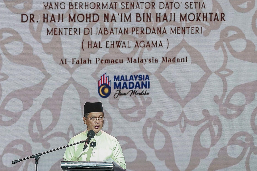 Minister in the Prime Minister’s Department (Religious Affairs) Datuk Mohd Na’im Mokhtar delivers a speech during the Maulidur Rasul Celebration at Putrajaya International Convention Centre, September 16, 2024. — Picture by Sayuti Zainudin