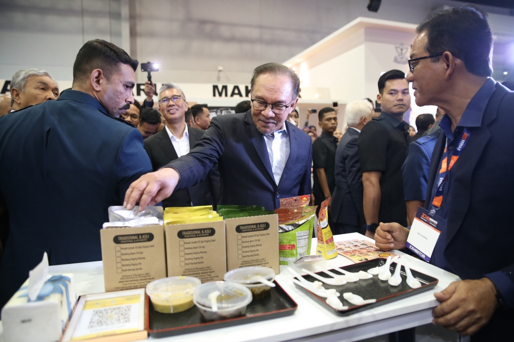 Prime Minister Datuk Seri Anwar Ibrahim visits an exhibition booth during the 20th Malaysia International Halal showcase opening ceremony at MITEC in Kuala Lumpur, September 17, 2024. — Picture by Yusof Mat Isa