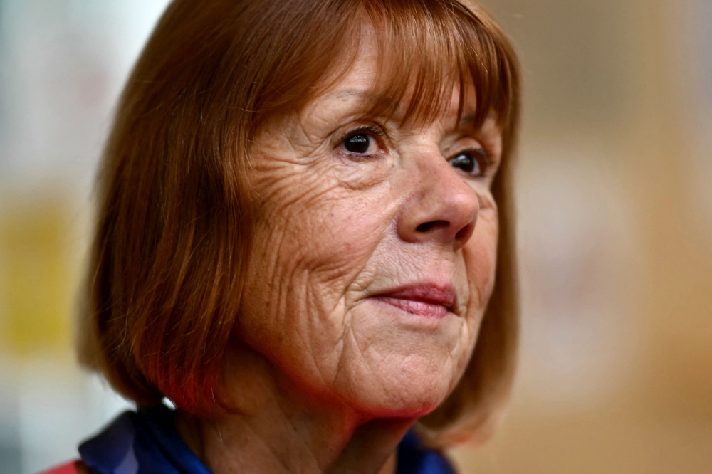 Gisele Pelicot looks on at the Avignon courthouse during the trial of her former partner Dominique Pelicot accused of drugging her for nearly ten years and inviting strangers to rape her at their home in Mazan, a small town in the south of France, in Avignon, on September 16, 2024. — AFP pic