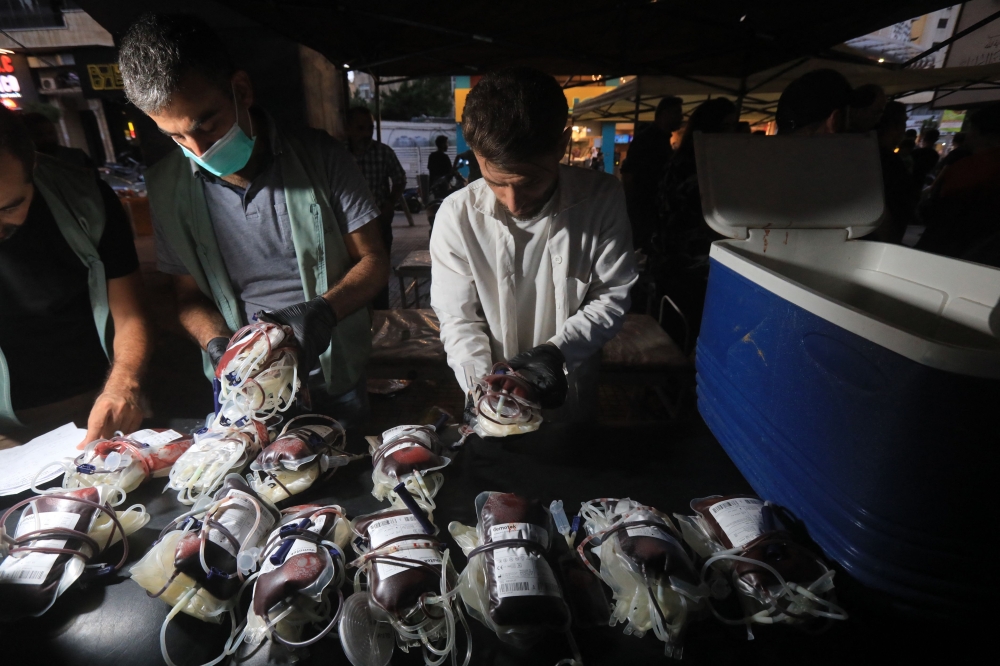 Medics collect blood donations in Beirut's southern suburb on September 17, 2024, after explosions hit locations in several Hezbollah strongholds around Lebanon amid ongoing cross-border tensions between Israel and Hezbollah fighters. — AFP pic