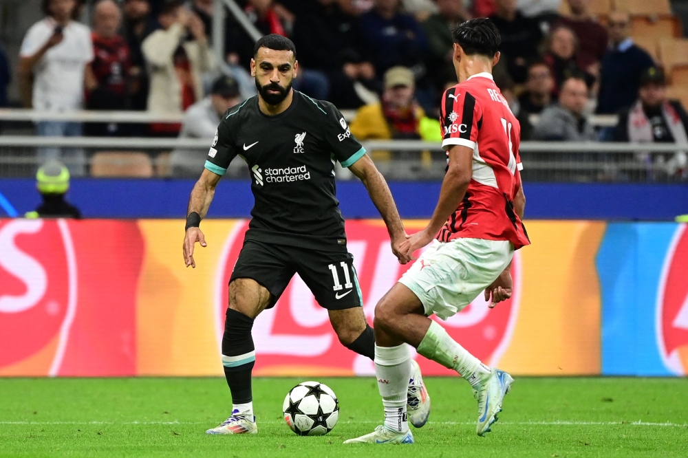 Liverpool's Egyptian forward #11 Mohamed Salah controls the ball during the UEFA Champions League 1st round day 1 football match between AC Milan and Liverpool FC at the San Siro stadium in Milan. — AFP pic