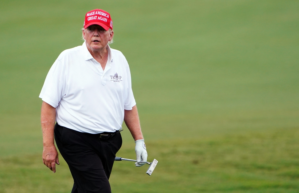 The head of the Secret Service told Donald Trump in a private meeting that significant new security arrangements will be needed if he wants to keep playing golf. — Reuters pic
