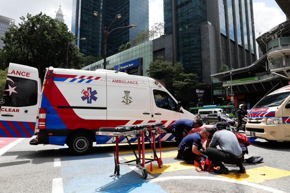 The King's personal medical team treat two motorcyclists involved in an accident on Jalan Sultan Ismail in Kuala Lumpur September 18, 2024. — Picture via Facebook