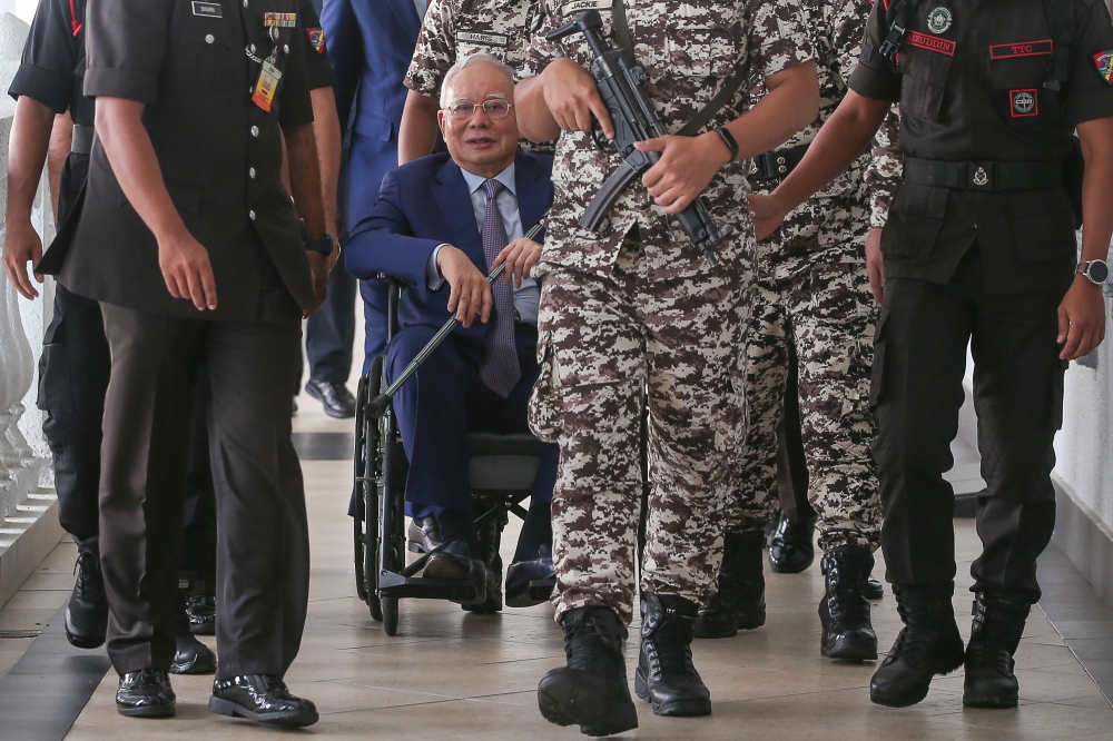 Former Prime Minister Datuk Seri Najib Razak is pictured in a wheelchair at the Kuala Lumpur High Court Complex on September 18, 2024. Picture by Yusof Mat Isa