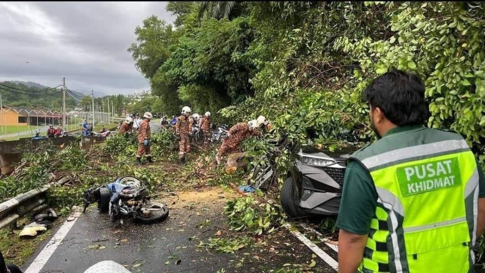 The motorcycle rider and passenger suffered severe injuries and were found unconscious at the scene. — Picture courtesy of the Fire and Rescue Department