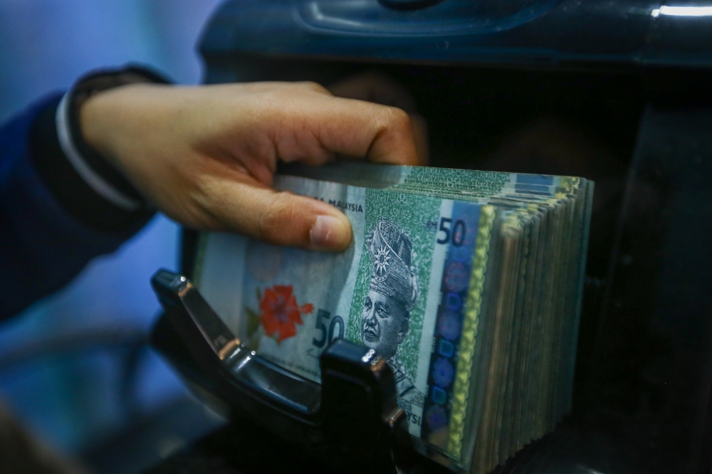 At 8.11am, the local note fell to 4.2100/2300 versus the greenback from Thursday’s 28-month high of 4.2025/2105. — Picture by Raymond Manuel
