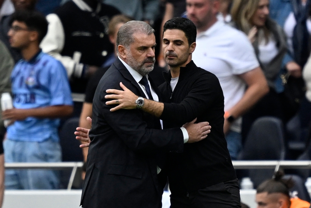 Tottenham Hotspur manager Ange Postecoglou (left) and Arsenal manager Mikel Arteta after the match on September 14, 2024. — Reuters pic