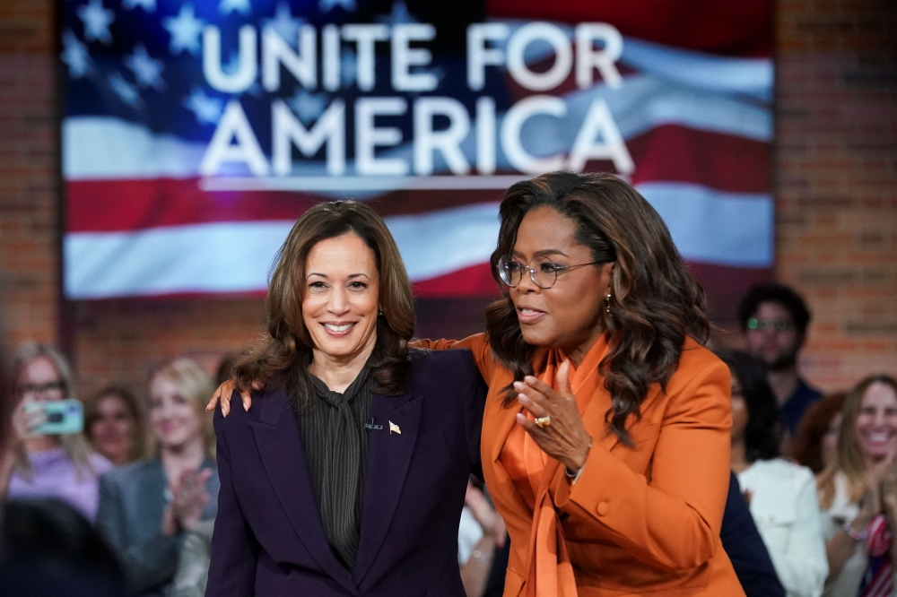 Democratic presidential nominee and U.S. Vice President Kamala Harris and Oprah Winfrey attend a campaign event in Detroit, Michigan, U.S., September 19, 2024. — Reuters pic