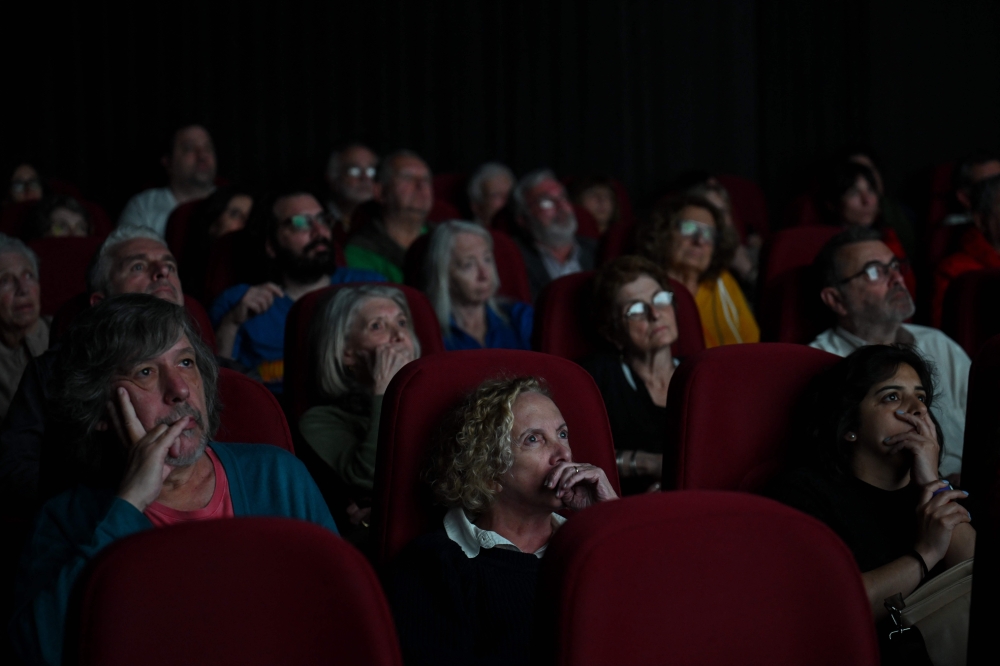 People watch the film ‘Traslados’ directed by Argentine Nicolas Gil Lavedra in Buenos Aires on September 17, 2024. — AFP pic