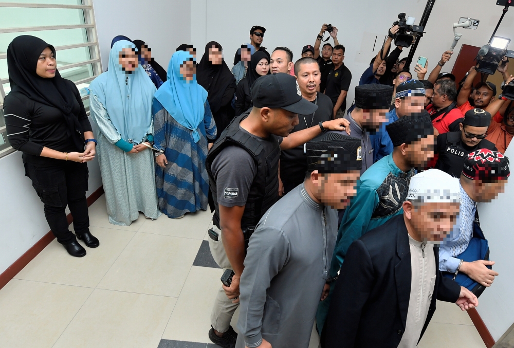 A total of 19 individuals, including the chief executive officer of Global Ikhwan Services and Business Holding (GISBH) and his wife, were brought to the Shah Alam Magistrates’ Court to seek a seven-day remand order, starting September 18, 2024. — Bernama pic