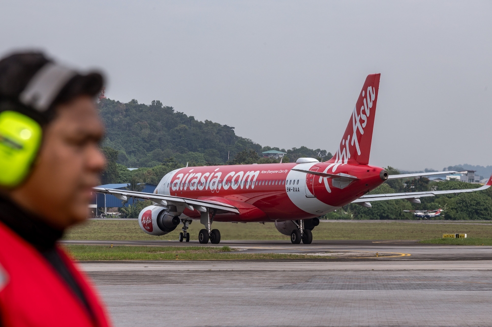 Capital A Bhd will hold an extraordinary general meeting on October 14, 2024, where the proposed disposal of its aviation business to sister company AirAsia X Bhd will be tabled for shareholders’ approval. — Picture by Firdaus Latif