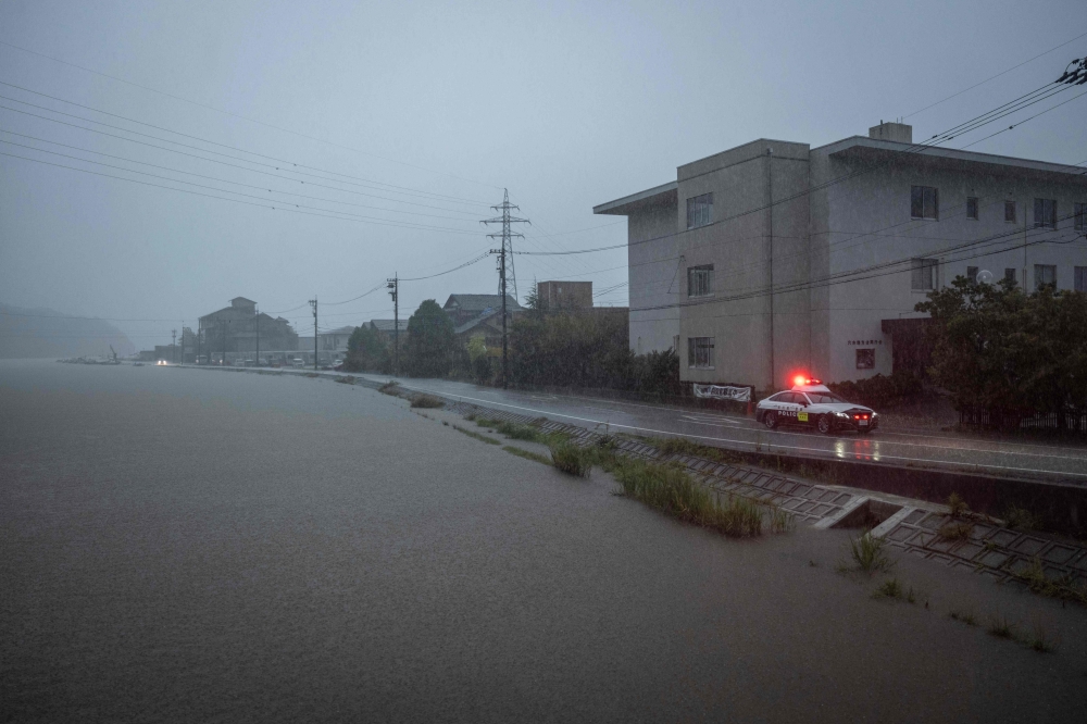 Japan issued a tsunami warning after a 5.6-magnitude earthquake struck Ishikawa prefecture on September 22, 2024. Heavy rains continue to lash the area, swelling rivers. — AFP pic