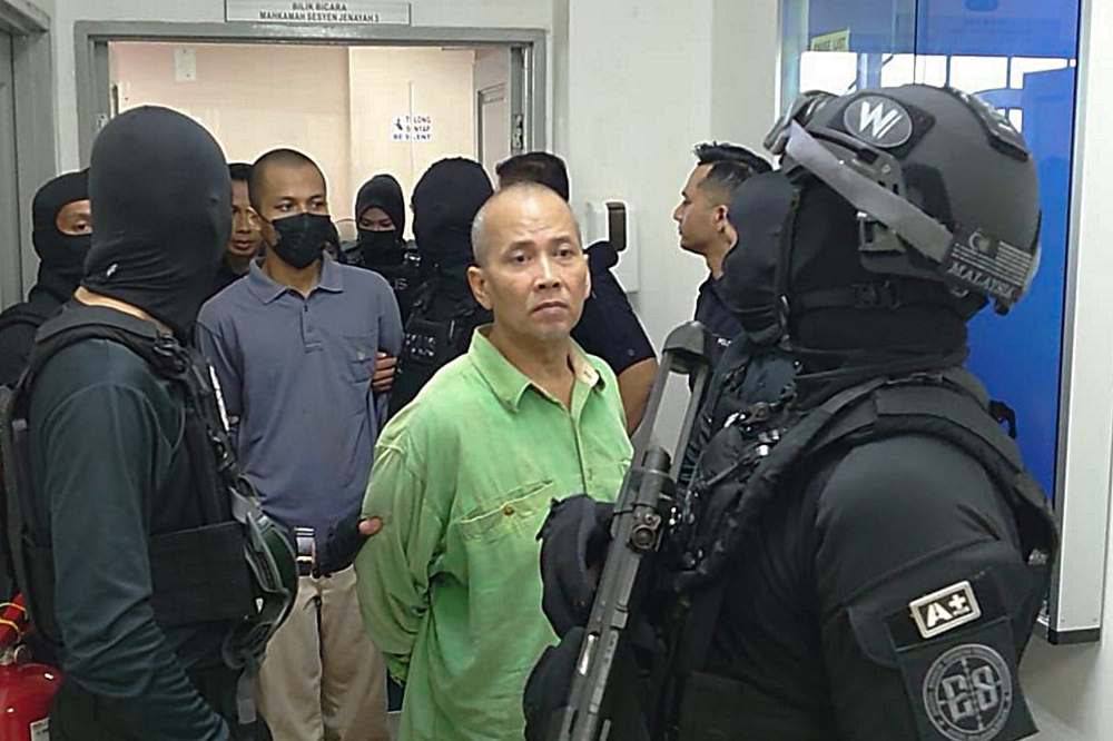 The court ordered Radin Imran Radin Mohd Yassin (in green shirt), 62; and Radin Romyullah Radin Imran, 34, to be detained in Sungai Buloh Prison, while Rosna Jantan, 59, and Farhah Sobrina Radin Imran, 23, were ordered to be held in Kajang Prison, both located in Selangor. Mariah Radin Imran, 19, was ordered to be admitted to the Permai Hospital here for a month for a mental health evaluation. — Bernama pic 