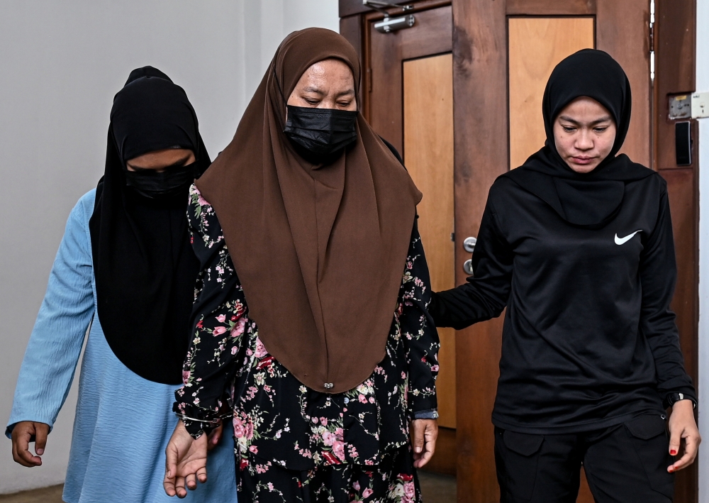 The accused, Wan Zaharah Wan Mahmud, 50, and Nuraihan Rozelan, 26, were jointly charged with causing physical harm to the right arm of a one-year-old girl. — Bernama pic 