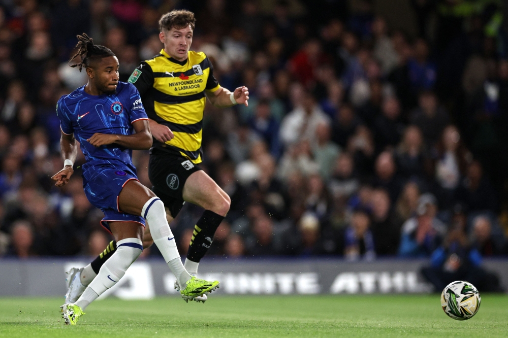 Christopher Nkunku scored a hat-trick as Chelsea thrashed fourth tier Barrow 5-0 to reach the last 16 of the League Cup yesterday. — AFP pic