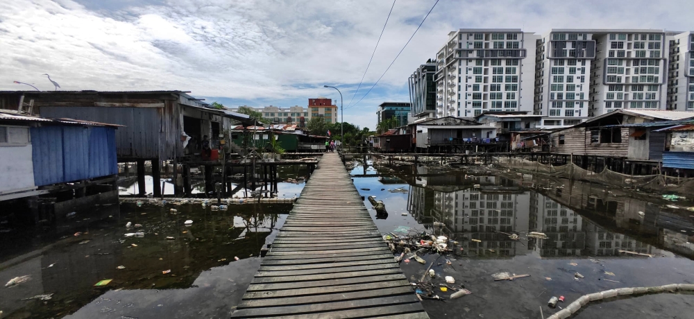 The Sembulan Tengah water village has a long history but has deteriorated into an eyesore, while its surroundings have rapidly developed. — Picture by Julia Chan