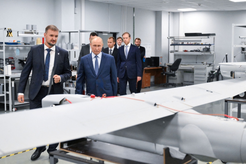 Russia's President Vladimir Putin visits a drone production facility of the the Special Technology Centre in Saint Petersburg, Russia September 19, 2024. — Reuters pic