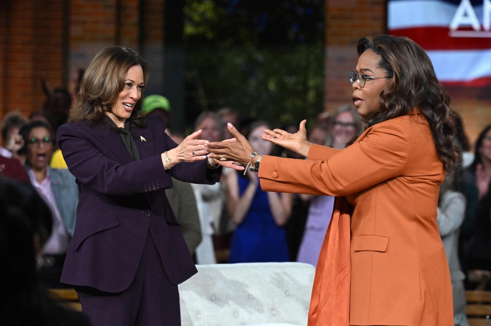 US Vice President and Democratic presidential candidate Kamala Harris admitted to Oprah Winfrey that she owns a gun and is not afraid of using it. — AFP pic