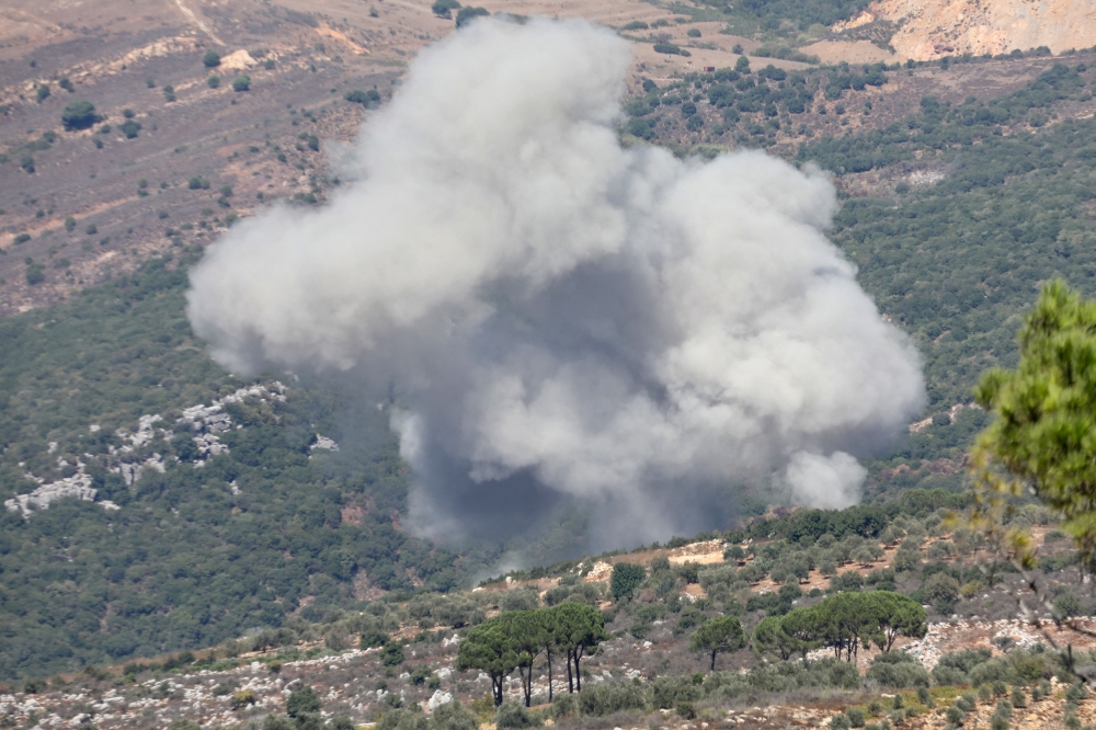 Smoke billows over southern Lebanon, amid ongoing cross-border hostilities between Hezbollah and Israeli forces, as seen from Marjayoun, near the border with Israel, September 26, 2024. — Reuters pic