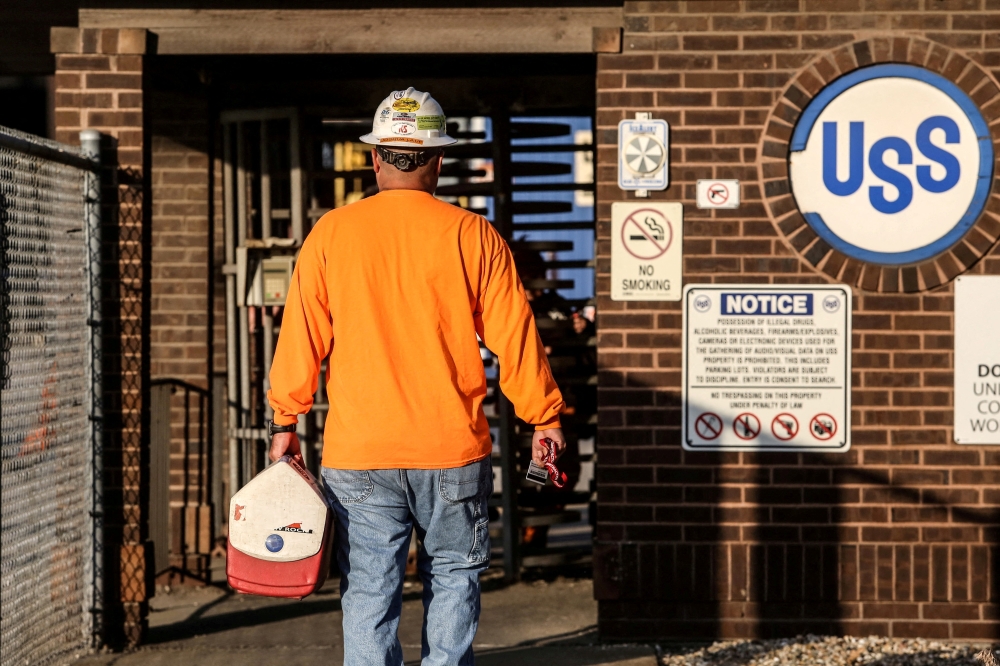 A steel worker returns to US Steel Granite City Works in Granite City, Illinois May 24, 2018. — Reuters pic  
