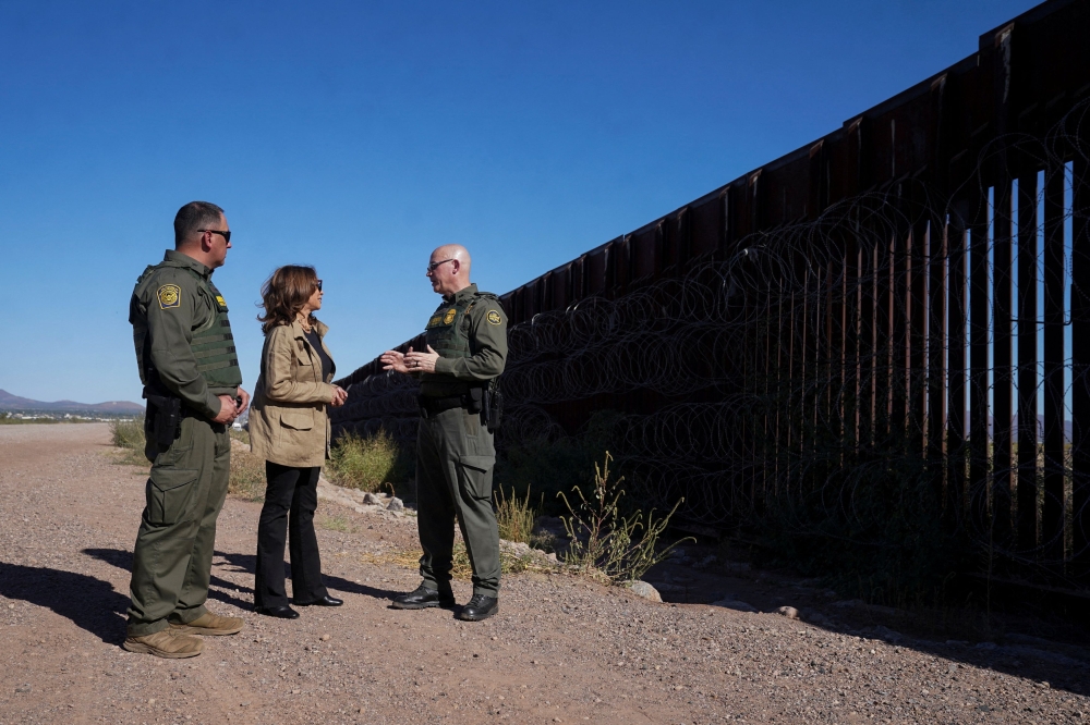 Democratic presidential nominee and US Vice President Kamala Harris tours the border wall with Border Patrol agents, near Tucson, in Douglas, Arizona September 27, 2024. — Reuters pic
