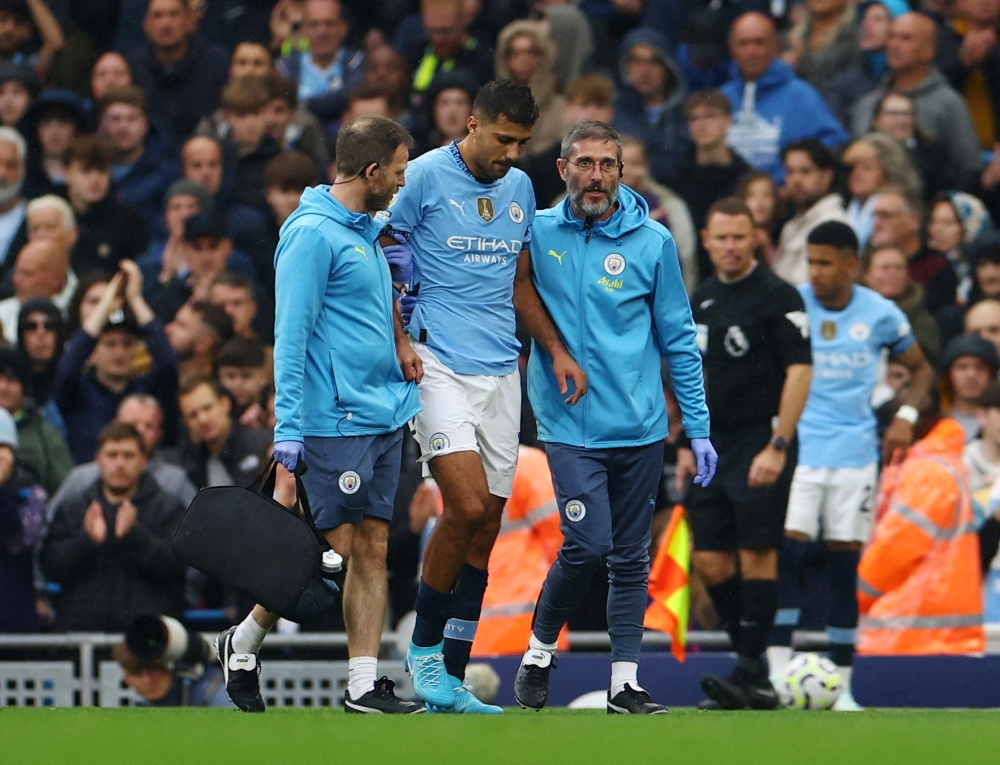 Manchester City’s Rodri walks off the pitch after sustaining an injury at Etihad Stadium, Manchester. — Reuters pic