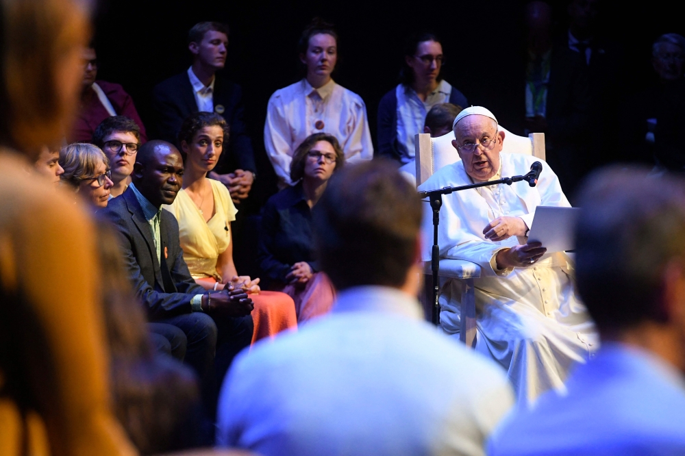 This handout photograph taken and released by the Vatican media on September 28, 2024, shows Pope Francis attending a meeting with students and members of the Catholic University of Louvain in Louvain-la-Neuve, Belgium. — AFP pic