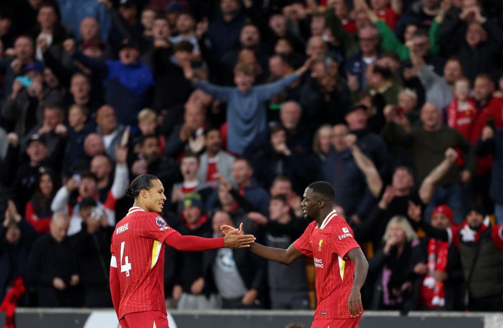 Liverpool’s Ibrahima Konate celebrates scoring his first goal against Wolverhampton Wanderers with teammate Virgil van Dijk during their Premier League match in Wolverhampton September 28, 2024. —  Action Images pic via Reuters