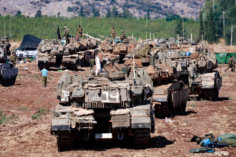 Israeli army tanks are deployed in the Upper Galilee region of northern Israel near the border with Lebanon on September 29, 2024. — AFP pic